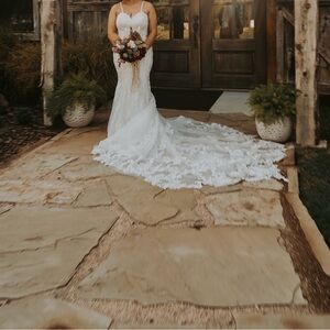 Elegant Lace Wedding Gown with Sweetheart Neckline and Cathedral Train
